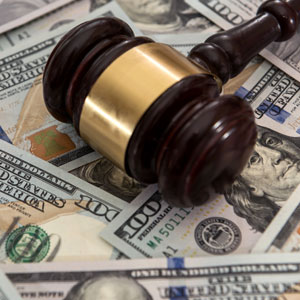 Gavel on US hundred dollar bills