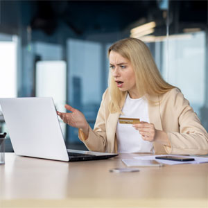 Client holding credit card during online consultation with law firm on dispute resolution.  